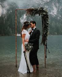 Wild Wedding Days On Instagram Lago Di Braies May Be The Most Perfect Backdrop For A Ro Aline Wedding Dress Wedding Dresses Satin Amazing Wedding Photography