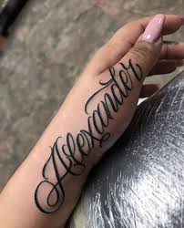 Name Tattoos For Women Ideas And Designs For Girls Bear In Mind That A Name Tattoo Is Going To Remai Name Tattoo On Hand Hand Tattoos Tattoo Lettering Styles