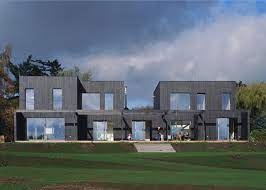 Give amish builders lumber, some hinges, and a mission; House For Two Families Triendl Und Fessler Architekten Archdaily