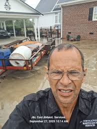 Handyman working in rain in Lumberton, North Carolina