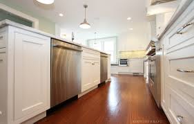 The sink should be flanked with landing areas of at least 24 inches on one side and 18 inches on the other. White Kitchen Island Cabinets With Two Dishwashers Kountry Kraft