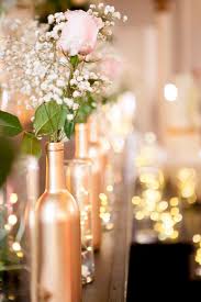 Almost anything can serve as décor for creative people. Hand Painted Gold Wine Bottle Centerpieces