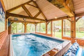 The Endless Pool Under This Gazebo Benefits From Indoor Protection And An Outdoor Feel Pool Gazebo Endless Pool Swimming Pools