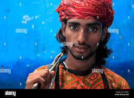 Rajendra Bhatt, who plays the 'Dhol' or Drums at his house in Kathputli  Colony in Delhi. Kathputli Colony , popularly known as the “Puppeteers  Colony” in Delhi is said to be demolished