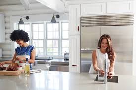 Set off crisply by the brown cabinets, the pendant lights are almost sculptural. Create A Chef Worthy Budget Kitchen Remodel Life At Home Trulia Blog