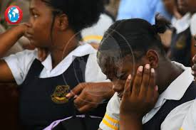 Relatives of 16-year-old Michion Campbell and students mourn the loss of  the Kingston Technical High School student during her memorial service at  Pentecostal Tabernacle