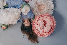 Maybe you would like to learn more about one of these? Dreamy Portrait Of Young Beautiful Girl With Long Hair Posed With Big Paper Flowers Of Pastel Colors By Liliya Rodnikova