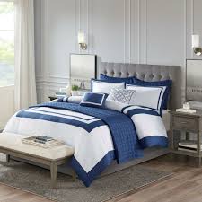 A nautical theme to any bedroom is a wonderful way to be whisked away too pirate islands and stories of privateers. Admiralty Navy And White King 8 Piece Comforter Set Caron S Beach House