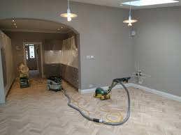 Once Fitted We Sand Parquet Flooring To Get Rid Of Any Raised Edges The Floor Is Then Sealed To Provide A Protec Stairs Cladding Floor Installation Cladding