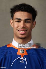 Isaiah George, #98 pick by the New York Islanders, poses for a... News  Photo