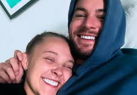 First pic of JoJo Siwa and Chris Hughes KISSING in the pool