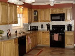 Let There Be Kitchen Light Black Appliances Kitchen Black Kitchens Affordable Kitchen Cabinets