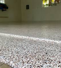 A Beautiful Garage Transformation Has Left This Floor With A Hard Wearing Easy To Clean And Oil And Tyre M Garage Floor Metallic Epoxy Floor Concrete Coatings