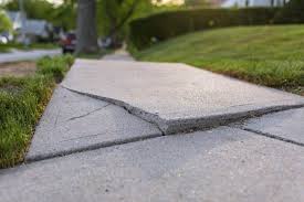 A depression in a concrete pad or driveway is a place for water to collect. Knoxville Concrete Leveling Polylevel Foundation Lifting American