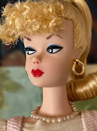 Admiring a Barbie Reproduction Doll