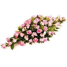 This design is usually the main tribute and can include favourite flowers or colours of the family or be themed. Pink Casket Spray Hollowpark Florists