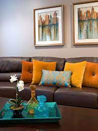 A Brown Leather Sofa Matches A Dark Wooden Coffee Table In Front Of The Neutral Living Room Brown Living Room Decor Living Room Orange Brown Couch Living Room