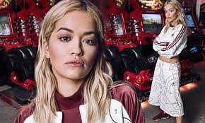 Rita Ora proudly unveils her new Adidas Originals collection in amusement  arcade shoot