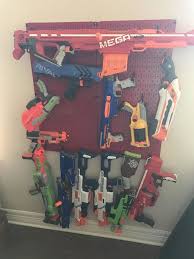 Ensure easy access to all your firepower with storage for up to 20 blasters, plus shelving and a drawer for lots of ammo and accessories! Bedroom Nerf Gun Storage Ideas
