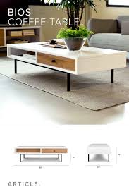 Beauty In Versatility The New Bios Table Pairs Smooth Glossy White Lacquer With Rugged Wi Center Table Living Room Centre Table Living Room Living Room Table