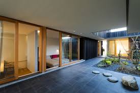 Inspiration for a large modern courtyard gravel patio kitchen remodel in seattle with a pergola 10 Stunning Structures With Gorgeous Inner Courtyards