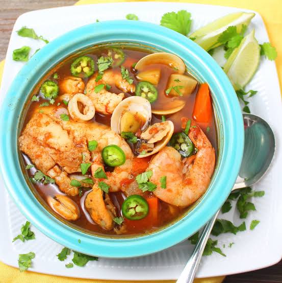 Sopa de Mariscos hangat kaya rempah khas Casa Patron, AI generated