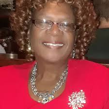 This beautifully composed portrait was taken by W. J. Ramsey in  Gainesville, Georgia. The young girl sits with folded hands, her hair  neatly braided, her printed dress crisp with a wide white
