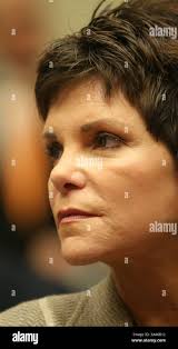 Hewlett-Packard former chairwoman Patricia Dunn, second from right, makes  her way to the Santa Clara Superior court accompanied by her husband,  William Jahnke, back left, her attorney, S. Raj Chatterjee, front left,