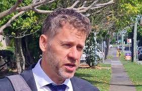 Cr Lyon spends night in police watch house after allegedly breaching AVO