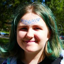 Dean of Students Willow Joffee and Dean of Residential Life Krisken  Lewis-Coward hosted a pop-up spirit festival and dance party at the Peace  pole. Students were able to get vibrant 'tattoos', have