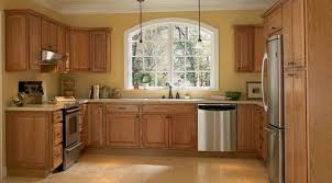 In addition, this room has wood flooring which is a lighter stain than the cabinets. 30 Inspiring Kitchen Paint Colors Ideas With Oak Cabinet Yellow Kitchen Walls Trendy Kitchen Colors Kitchen Design