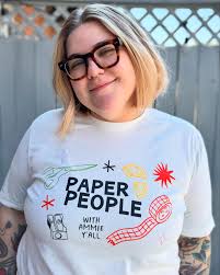 Paper People merch is here! We've got the coziest crewnecks (Gildan brand  in Ash) and the softest tshirts in cream and light blue (Bella + Canvas  brand in Heather Ice Blue and