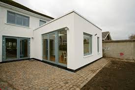 Toy plastic house with an extension and balcony. Mt Building Services