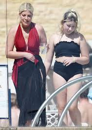Stella's 8th birthday party, part 2. Tori Spelling Wears A Crimson Swimsuit To The Pool With Her Husband Dean Mcdermott For Mother S Day Geeky Craze
