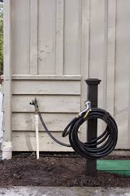 Simple Diy Hose Holder Simply Organized Hose Holder Garden Hose Holder Garden Hose