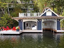 Boat House With Sitting Room And Deep Blue Wood Paneling Muskoka Living Interiors Lake House Floating House Lakeside Living