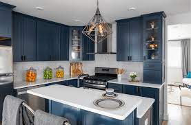 All white cabinetry with gold drawer pulls are a match made in (hipster) heaven. Kitchen Trend Navy Blue Cabinets Scott Mcgillivray