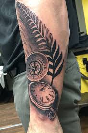 The appearance of crosses and a certain creature clinging to the clock gives this tattoo a spooky look. Clock Compass Clock Half Chest Tattoos Novocom Top