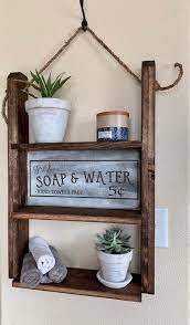 Rustic wood and rope hanging shelf. 50 Best Farmhouse Bathroom Design And Decor Ideas For 2021