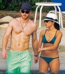 Prince Harry And Meghan Markle Are Spotted At A Beach In Jamaica With Friends They Were On Prince Harry And Megan Prince Harry And Meghan Meghan Markle Style