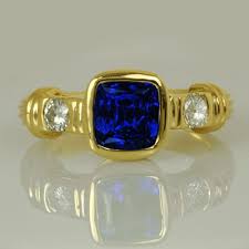 Tanzanite And Diamond Ring One Of A Kind This Unique Ring With A Ribbed 18kt Yellow Gold Band And Its Explosive Tanz Rare Gemstones Tanzanite Jewelry Jewelry