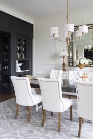 A strong, sturdy hutch brings practicality and presence to your design. White Transitional Dining Room With Black Cabinet Hgtv