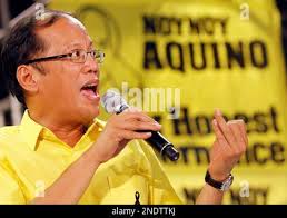 Opposition presidential candidate Corazon Aquino waves back at the crowd  shortly upon arrival for a campaign rally in Koronadal, 625 miles southeast  of Manila, Jan. 20, 1986. Mrs. Aquino and her vice