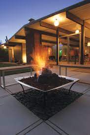 Add an outdoor fire pit that stands out from the rest with this black steel chiminea. Modern Fire Pit The Upgrade Your Backyard Needs This Fall Home