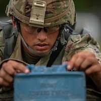 US Air Force (USAF) STAFF Sergeant (SSGT) Christopher Campbell of the 366th  Communication Squadron (CS), 366th Fighter Wing (FW), Mountain Home Air  Force Base (AFB), Idaho (ID), carries his mobility equipment into