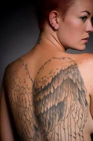 The angel wings tattoo design memorialize passed loved ones and often accompany other religious or personal symbols. Angel Wings Tattoos Design Photos Lovetoknow