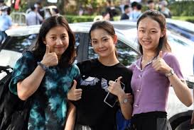 Examinees Pose Pictures Outside Exam ...