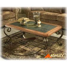Andy b on jan 6, 2020 best answer: T383 1 Ashley Furniture Rect Cktl Slate Metal Brn Fnsh