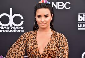 The singer typically sports blonde hair of various shades but went for hot pink in february 2021. Demi Lovato Dip Dyed Her Hair Neon Pink Photos Allure