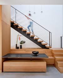 Amazing gallery of interior design and decorating ideas of under the stairs foyer table in bathrooms, entrances/foyers by elite interior designers. A Dining Area Was Included In The Design Of These Stairs